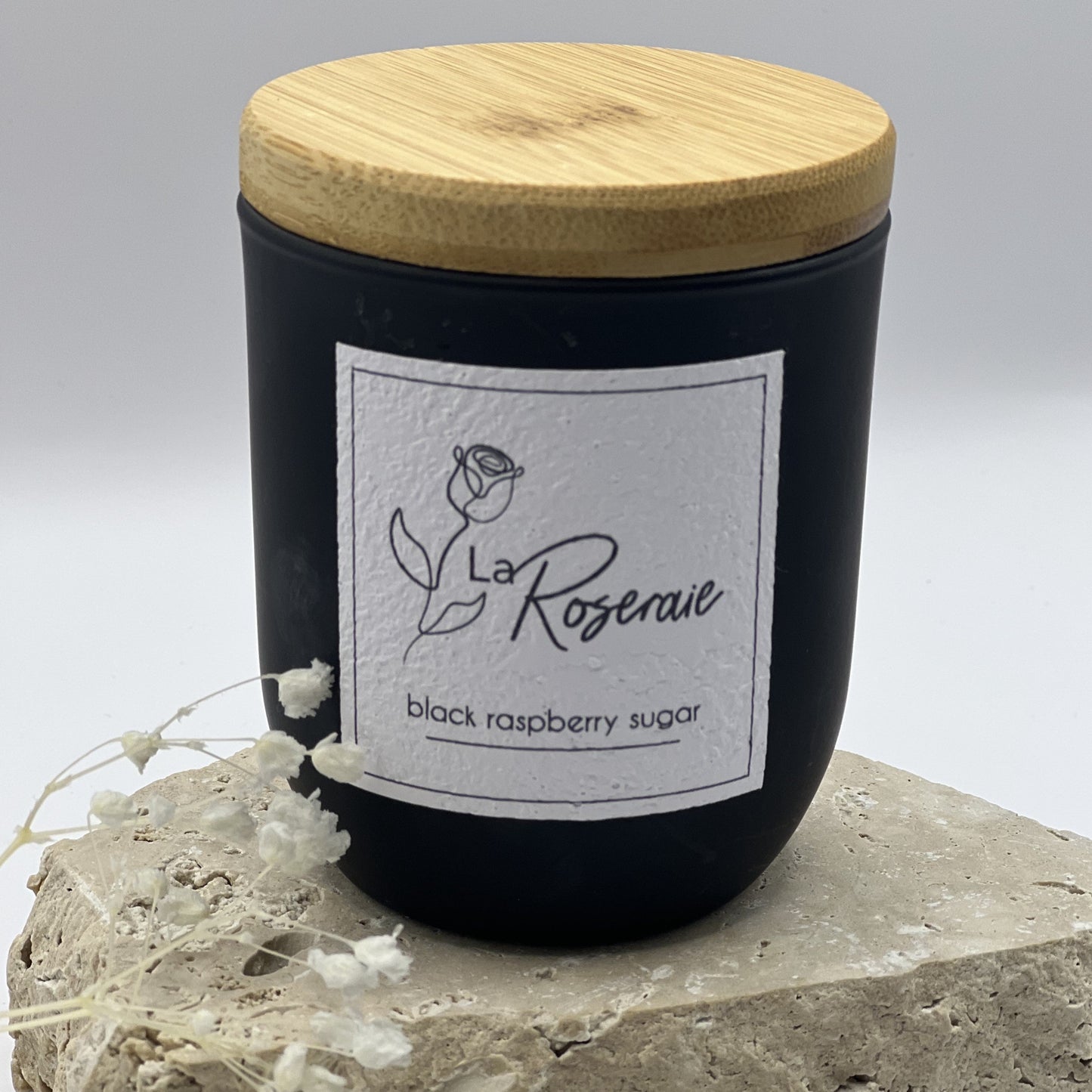 Classic collection coco soy candle in matte black jar with matching natural timber lid. Black Raspberry & Sugar fragrance.